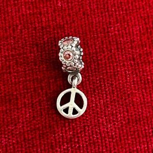 Authentic Pandora Peace Sign Charm. S925 ALE. Excellent pre-owned condition.